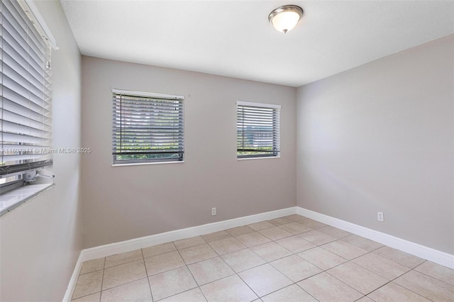 2240 NW 47th Ter, Lauderhill, FL 33313 - unfurnished room with light tile patterned floors and baseboards