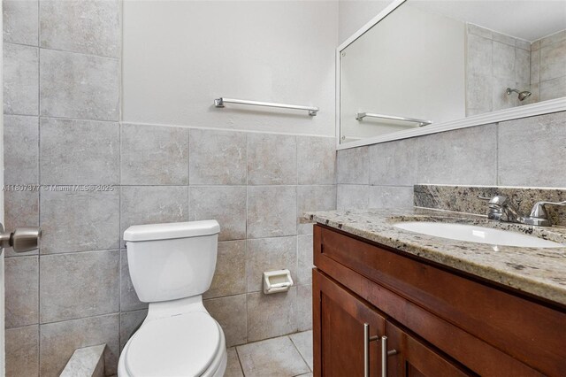 2240 NW 47th Ter, Lauderhill, FL 33313 - bathroom with tile walls, vanity, and toilet