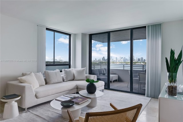 1330 W Ave Unit 902, Miami Beach, FL 33139 - living area featuring a view of skyline, expansive windows, and plenty of natural light