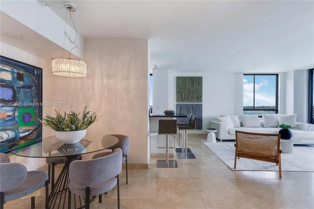 1330 W Ave Unit 902, Miami Beach, FL 33139 - dining area with a chandelier and tile patterned floors