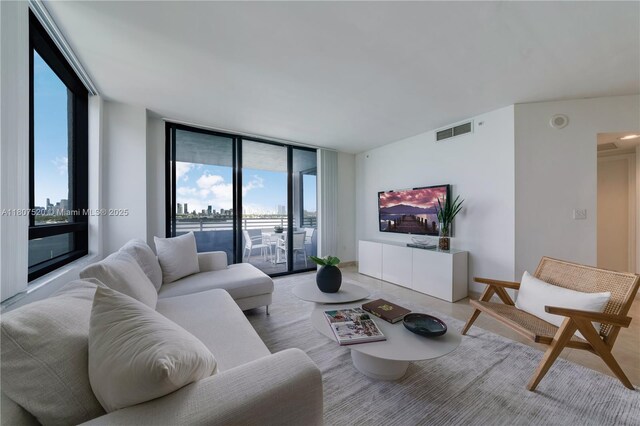 1330 W Ave Unit 902, Miami Beach, FL 33139 - living area featuring plenty of natural light and expansive windows