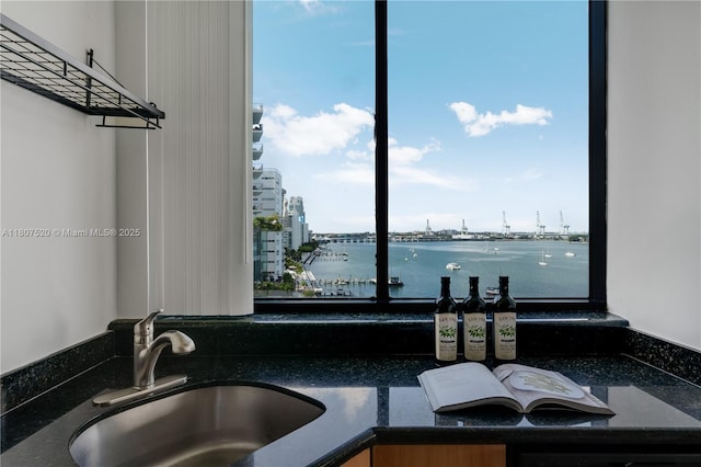 1330 W Ave Unit 902, Miami Beach, FL 33139 - kitchen with a sink, dark stone counters, and a view of city