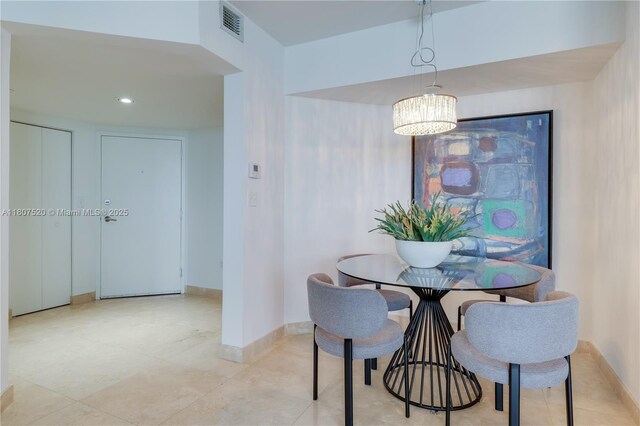 1330 W Ave Unit 902, Miami Beach, FL 33139 - dining space with a chandelier and baseboards