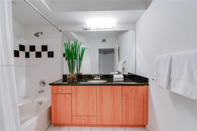 1330 W Ave Unit 902, Miami Beach, FL 33139 - full bath featuring shower / bath combo with shower curtain, vanity, and tile patterned flooring