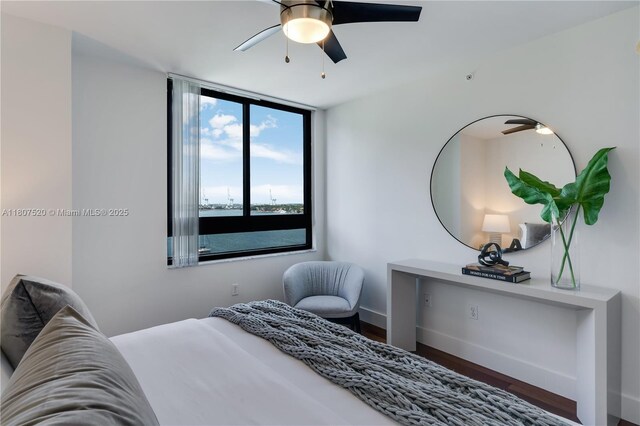 1330 W Ave Unit 902, Miami Beach, FL 33139 - bedroom with wood finished floors, baseboards, and a ceiling fan