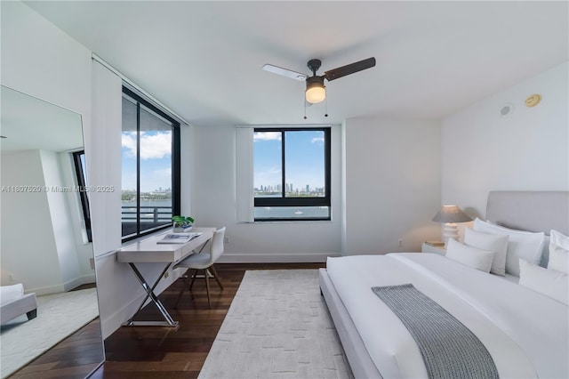 1330 W Ave Unit 902, Miami Beach, FL 33139 - bedroom featuring dark wood finished floors, baseboards, and ceiling fan