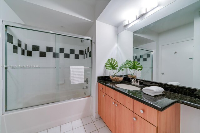 1330 W Ave Unit 902, Miami Beach, FL 33139 - bathroom featuring vanity, shower / bath combination with glass door, and tile patterned flooring
