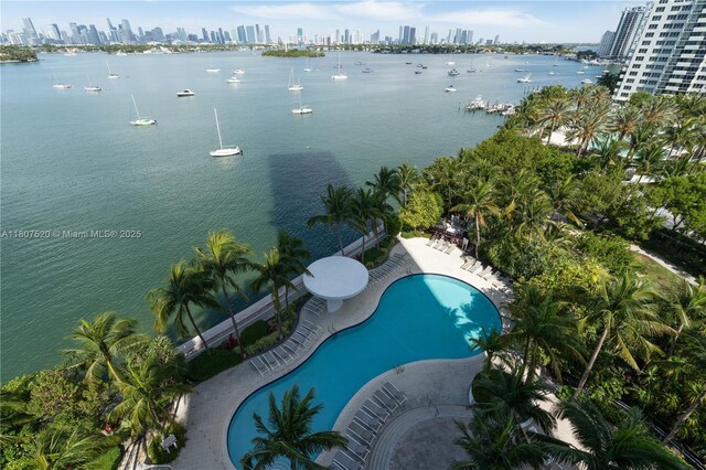 1330 W Ave Unit 902, Miami Beach, FL 33139 - drone / aerial view of city skyline, a pool, and a nearby body of water