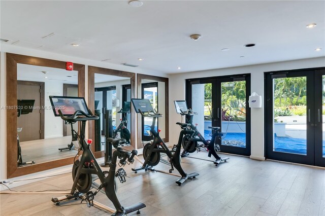 1330 W Ave Unit 902, Miami Beach, FL 33139 - exercise room featuring french doors, light wood finished floors, and recessed lighting
