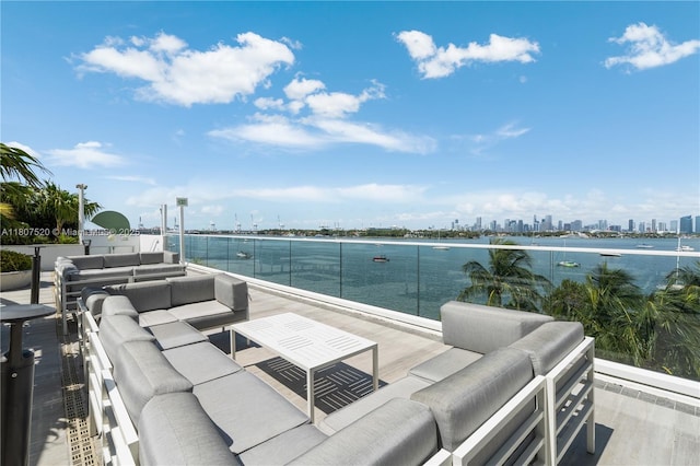 1330 W Ave Unit 902, Miami Beach, FL 33139 - view of patio / terrace featuring an outdoor living space, a view of skyline, and a water view