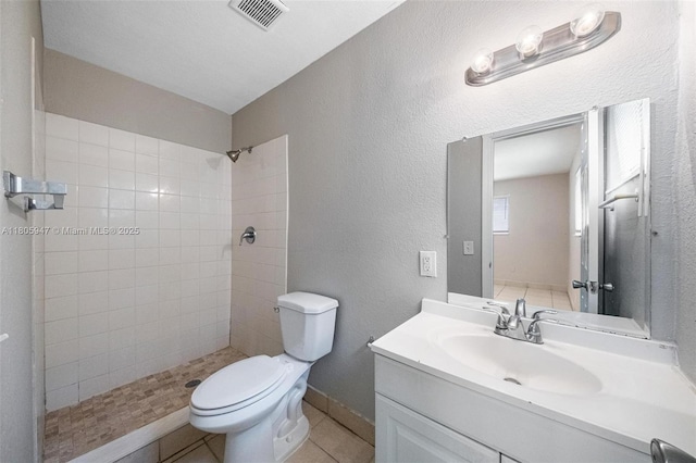 6871 SW 18th St, North Lauderdale, FL 33068 - full bath with tiled shower, vanity, toilet, a textured wall, and tile patterned flooring
