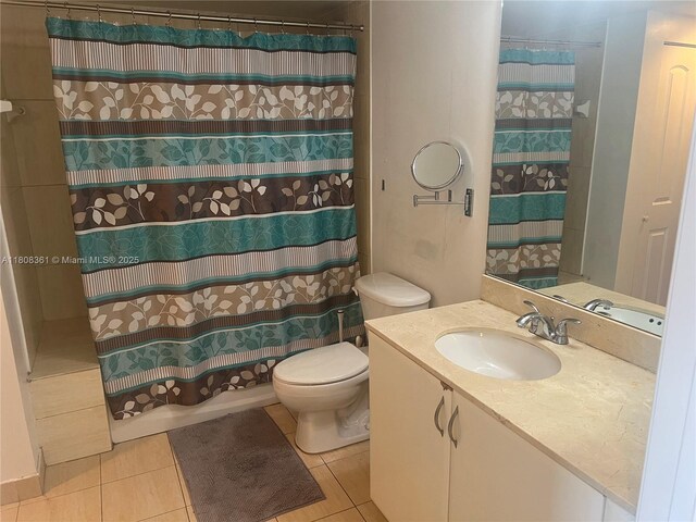 1750 N Bayshore Dr Unit 1410, Miami, FL 33132 - full bath featuring vanity, toilet, tile patterned flooring, and curtained shower