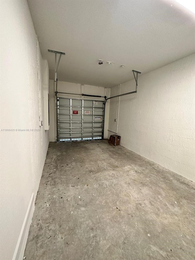 11965 NW 47th Mnr, Coral Springs, FL 33076 - garage featuring a textured wall