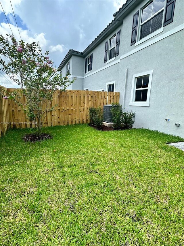 11965 NW 47th Mnr, Coral Springs, FL 33076 - view of yard with central air condition unit