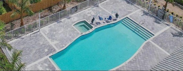 11965 NW 47th Mnr, Coral Springs, FL 33076 - drone / aerial view of a pool area