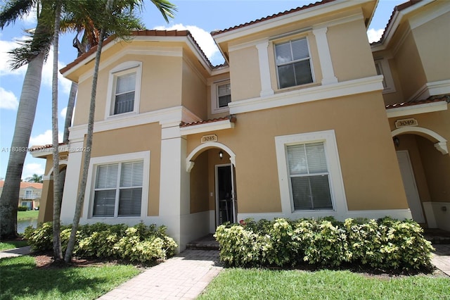 3045 SW 129th Way Unit 152, Miramar, FL 33027 - view of front facade featuring stucco siding and a tile roof