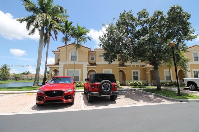 3045 SW 129th Way Unit 152, Miramar, FL 33027 - view of front of home featuring uncovered parking, stucco siding, and a water view