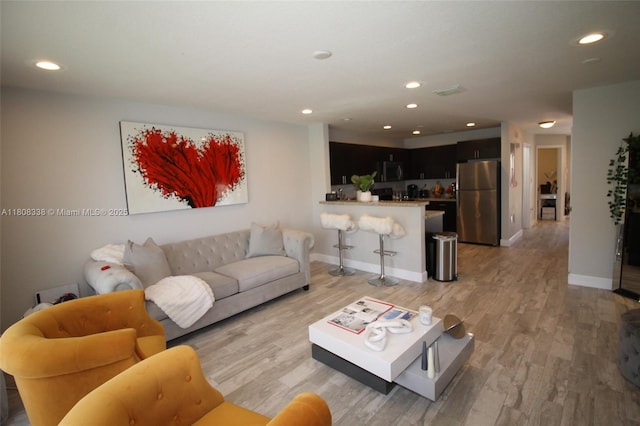 3045 SW 129th Way Unit 152, Miramar, FL 33027 - living room with light wood finished floors, recessed lighting, and baseboards
