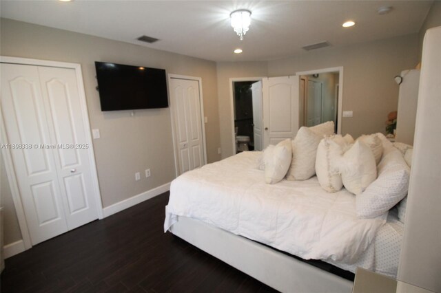 3045 SW 129th Way Unit 152, Miramar, FL 33027 - bedroom with multiple closets, dark wood-style floors, baseboards, and recessed lighting