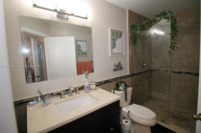 3045 SW 129th Way Unit 152, Miramar, FL 33027 - full bathroom with vanity, tile walls, toilet, and tiled shower