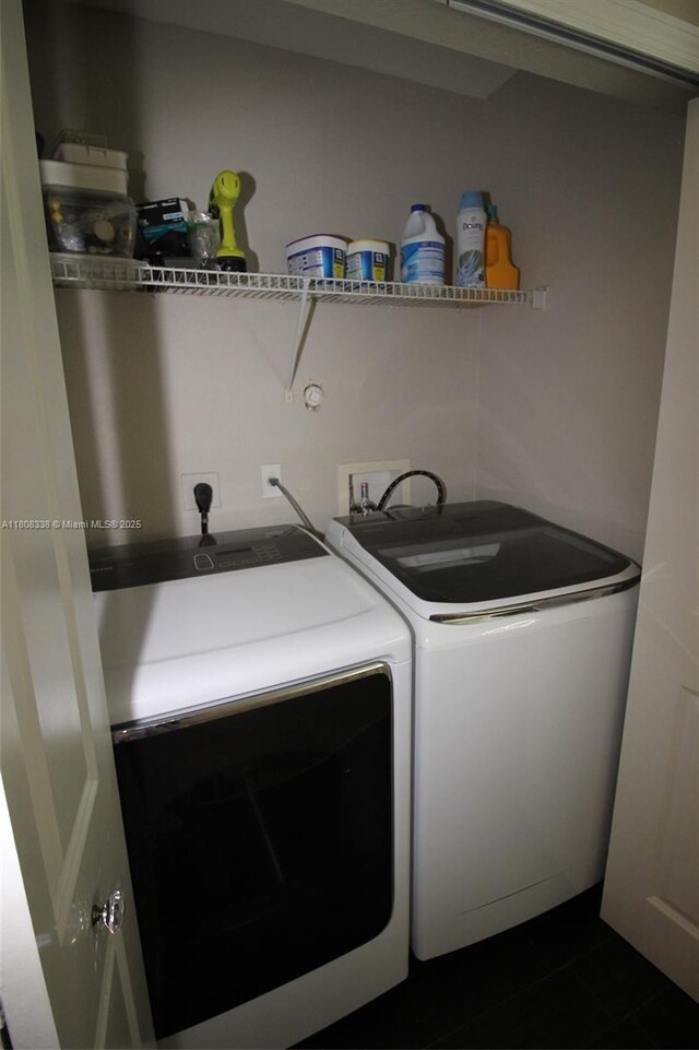 3045 SW 129th Way Unit 152, Miramar, FL 33027 - laundry room featuring washing machine and dryer and dark tile patterned flooring
