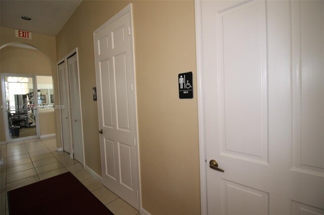 3045 SW 129th Way Unit 152, Miramar, FL 33027 - hall with light tile patterned floors, arched walkways, and baseboards