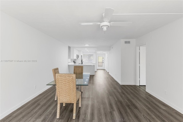3591 Inverrary Dr Unit 203, Lauderhill, FL 33319 - unfurnished dining area featuring dark wood-type flooring and baseboards