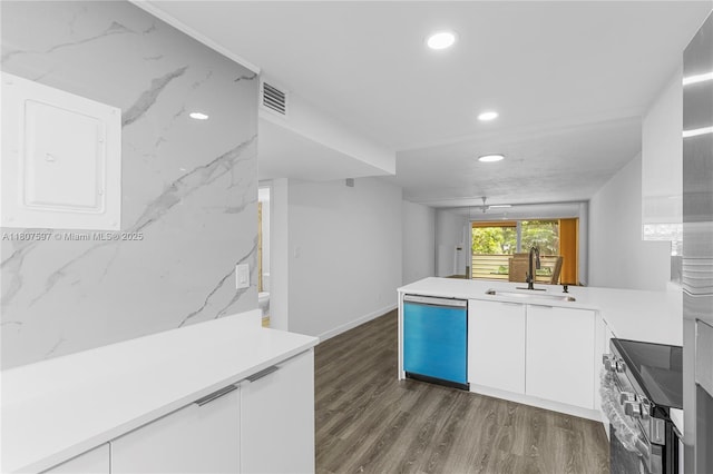 3591 Inverrary Dr Unit 203, Lauderhill, FL 33319 - kitchen featuring dishwashing machine, stainless steel range with electric stovetop, a sink, dark wood-type flooring, and white cabinets