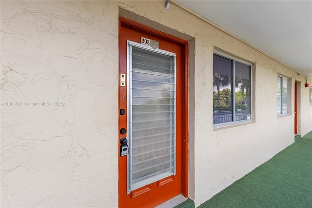 3591 Inverrary Dr Unit 203, Lauderhill, FL 33319 - doorway to property with stucco siding