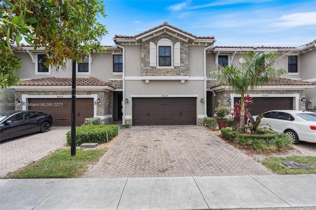 9618 Waterview Way, Parkland, FL 33076 - multi unit property with stone siding, stucco siding, decorative driveway, a garage, and a tile roof