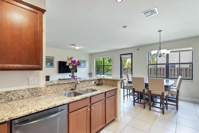 9618 Waterview Way, Parkland, FL 33076 - kitchen with dishwasher, a sink, a peninsula, a chandelier, and light stone countertops