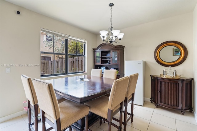 9618 Waterview Way, Parkland, FL 33076 - dining room with a chandelier, light tile patterned floors, and baseboards