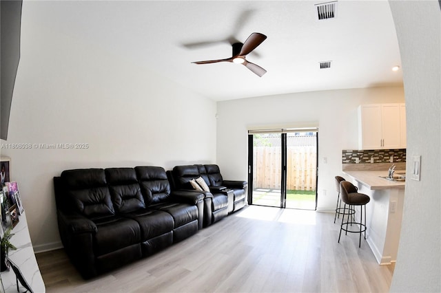 21068 NE 8th Ave, Miami, FL 33179 - living room featuring light wood-style flooring and ceiling fan