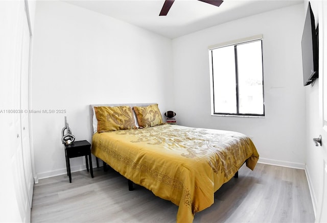 21068 NE 8th Ave, Miami, FL 33179 - bedroom with wood finished floors, baseboards, and a ceiling fan