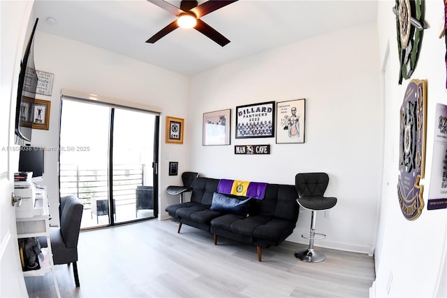 21068 NE 8th Ave, Miami, FL 33179 - living room with wood finished floors, ceiling fan, and a desk