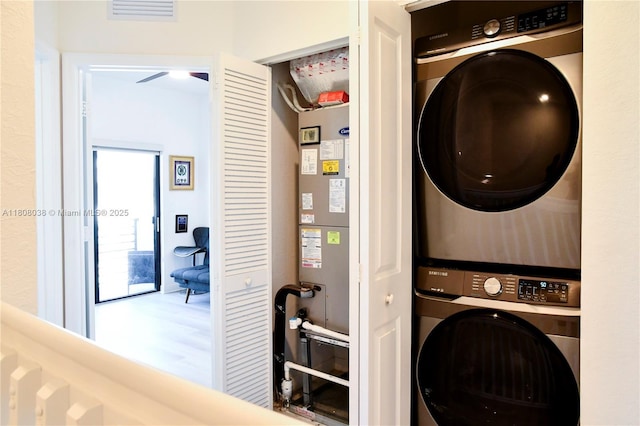 21068 NE 8th Ave, Miami, FL 33179 - laundry room featuring stacked washer and clothes dryer