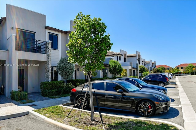 21068 NE 8th Ave, Miami, FL 33179 - uncovered parking lot with a residential view