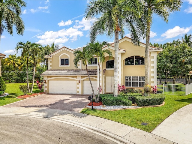 3945 Heron Ridge Ln, Weston, FL 33331 - mediterranean / spanish-style home with stucco siding, a garage, and decorative driveway