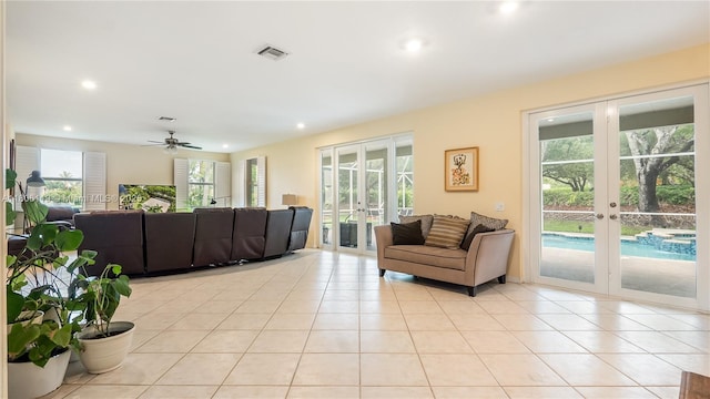 3945 Heron Ridge Ln, Weston, FL 33331 - living area with french doors, recessed lighting, light tile patterned floors, and ceiling fan