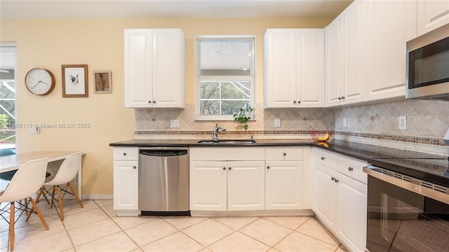 3945 Heron Ridge Ln, Weston, FL 33331 - kitchen with appliances with stainless steel finishes, a sink, dark countertops, and decorative backsplash