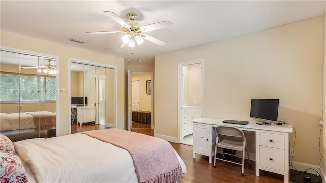 3945 Heron Ridge Ln, Weston, FL 33331 - bedroom with dark wood-style flooring, an office area, baseboards, a ceiling fan, and ensuite bathroom