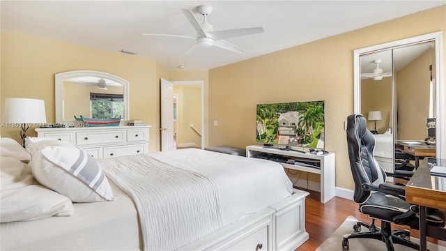 3945 Heron Ridge Ln, Weston, FL 33331 - bedroom featuring wood finished floors, a desk, a ceiling fan, and baseboards