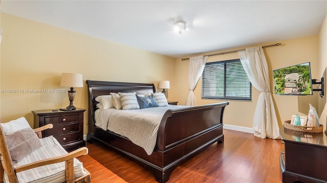 3945 Heron Ridge Ln, Weston, FL 33331 - bedroom featuring baseboards and wood finished floors