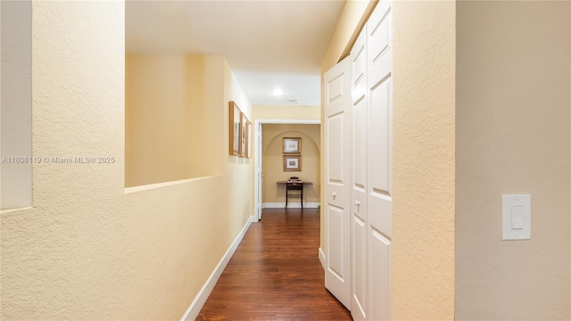 3945 Heron Ridge Ln, Weston, FL 33331 - corridor with a textured wall, dark wood-style flooring, and baseboards