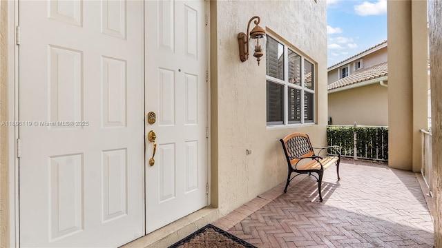 3945 Heron Ridge Ln, Weston, FL 33331 - entrance to property with stucco siding and covered porch