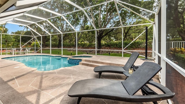 3945 Heron Ridge Ln, Weston, FL 33331 - view of swimming pool with a patio area, glass enclosure, and a pool with connected hot tub