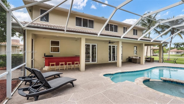 3945 Heron Ridge Ln, Weston, FL 33331 - back of property featuring a patio area, stucco siding, french doors, and a pool with connected hot tub