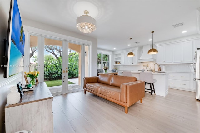 12480 SW 125th Ter, Miami, FL 33186 - living area with french doors, light wood-style floors, recessed lighting, and a chandelier