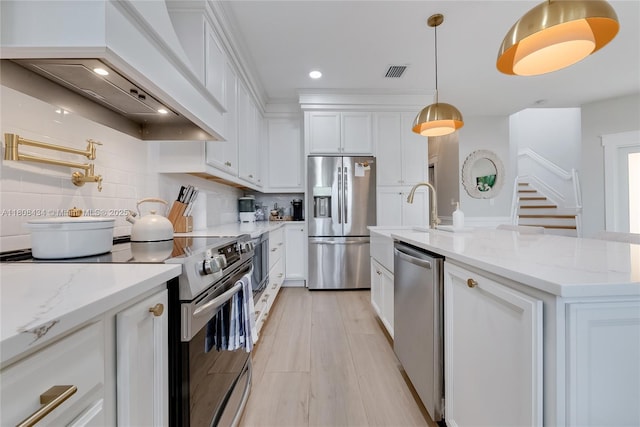 12480 SW 125th Ter, Miami, FL 33186 - kitchen featuring appliances with stainless steel finishes, custom range hood, white cabinetry, backsplash, and recessed lighting