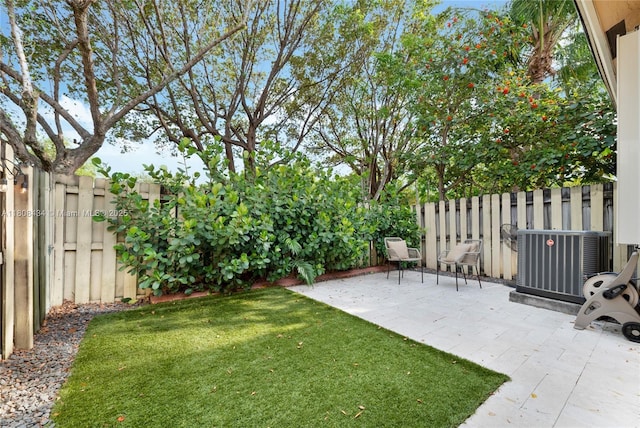 12480 SW 125th Ter, Miami, FL 33186 - view of yard featuring central air condition unit and a patio